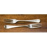 A pair of George III forks, hallmark, probably for London is very rubbed,