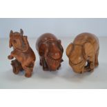 Three wooden Japanese Netsukes of elephants