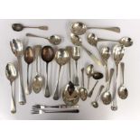 A collection of assorted silver plated flatware,