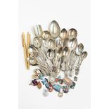A collection of assorted silver plated souvenir spoons,