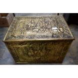 A large Victorian style brass bound rectangular coal skuttle, chased with figures,