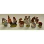 Twelve Royal Albert Beatrix Potter figurines including Christmas Stocking and Mittens and Moppet
