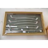 Seven church warden clay pipes in framed case