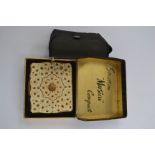 A Stratton musical compact box,