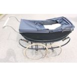 A Millsons, possible early 20th century pram, black body, deep blue hood, measuring approx,