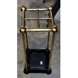 A brass and cast iron umbrella or stick stand,