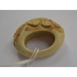 An antique carved ivory toggle