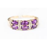 An amethyst and diamond set 9 ct gold ring