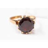 A 9ct garnet dress ring, round garnet claw set, size L,