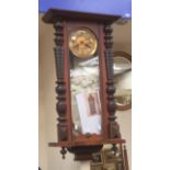 A 19th Century Vienna wall clock working with all attachments within casing