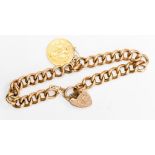 A 9ct rose gold padlock bracelet with a suspended George V half sovereign. Bracelet measures 7.