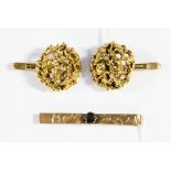 A pair of 9ct gold organic design cuff links, together with a 9ct gold and gem set tie clip,