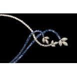 A diamond and sapphire set fronted 18ct white gold necklace,