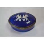 A Bilston cobalt blue enamel snuff box with raised pattern of two love birds in white.