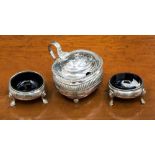 Two George III silver salt cellars, squat ovoid form on three stepped C scroll feet,