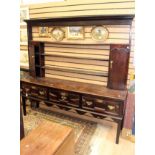 An 18th century and later oak dresser and rack,joined construction,fitted with three drawers,