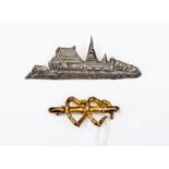 A 9ct gold sweetheart brooch A/F, together with a Siamese silver brooch,