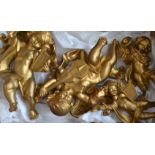 Four Italian gilt figures of cherubs, of various sizes,