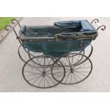 An early 20th century pram, unnamed, green and blue painted body, slight chipping,