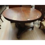 An early 19th Century mahogany round tilt top pedestal breakfast table..