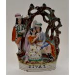 A 19th Century Staffordshire flatback figure group, of a courting couple, with another man,