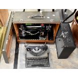 Cased sewing machine with a cased vintage typewriter