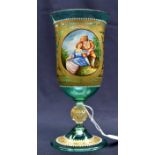 A Venetian green glass goblet, with a hand painted panel depicting a courting couple,