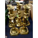 Four pairs of Victorian Welsh brass candlesticks,