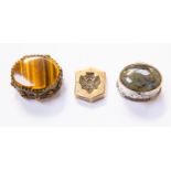 A Continental silver oval pill box set with stone; a tigers eye set box;