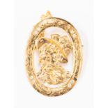 A 9ct gold and diamond set brooch, oval brooch with central cut out detail of a lady,