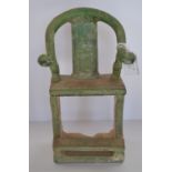A Chinese Ming Dynasty stylized votive chair, green glaze with hexagonal decoration to the seat,