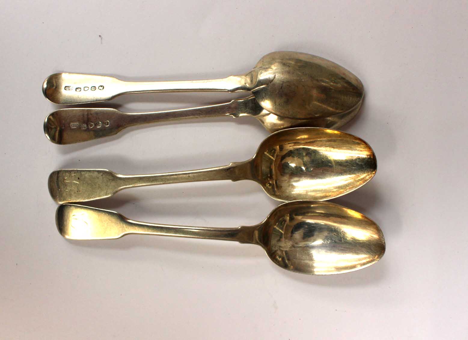 A set of four George III silver dessert spoons, London 1820, makers mark for George Piercy,