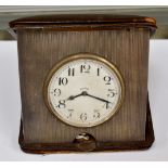 An Edwardian leather cased eight day silver travelling clock, London 1910,