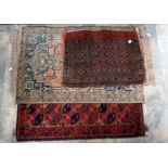A collection of various woollen rugs, including one possibly Persian,