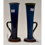 A pair of Bourne Denby blue glazed single handed trumpet vases, with brown bases, stamped to bases,