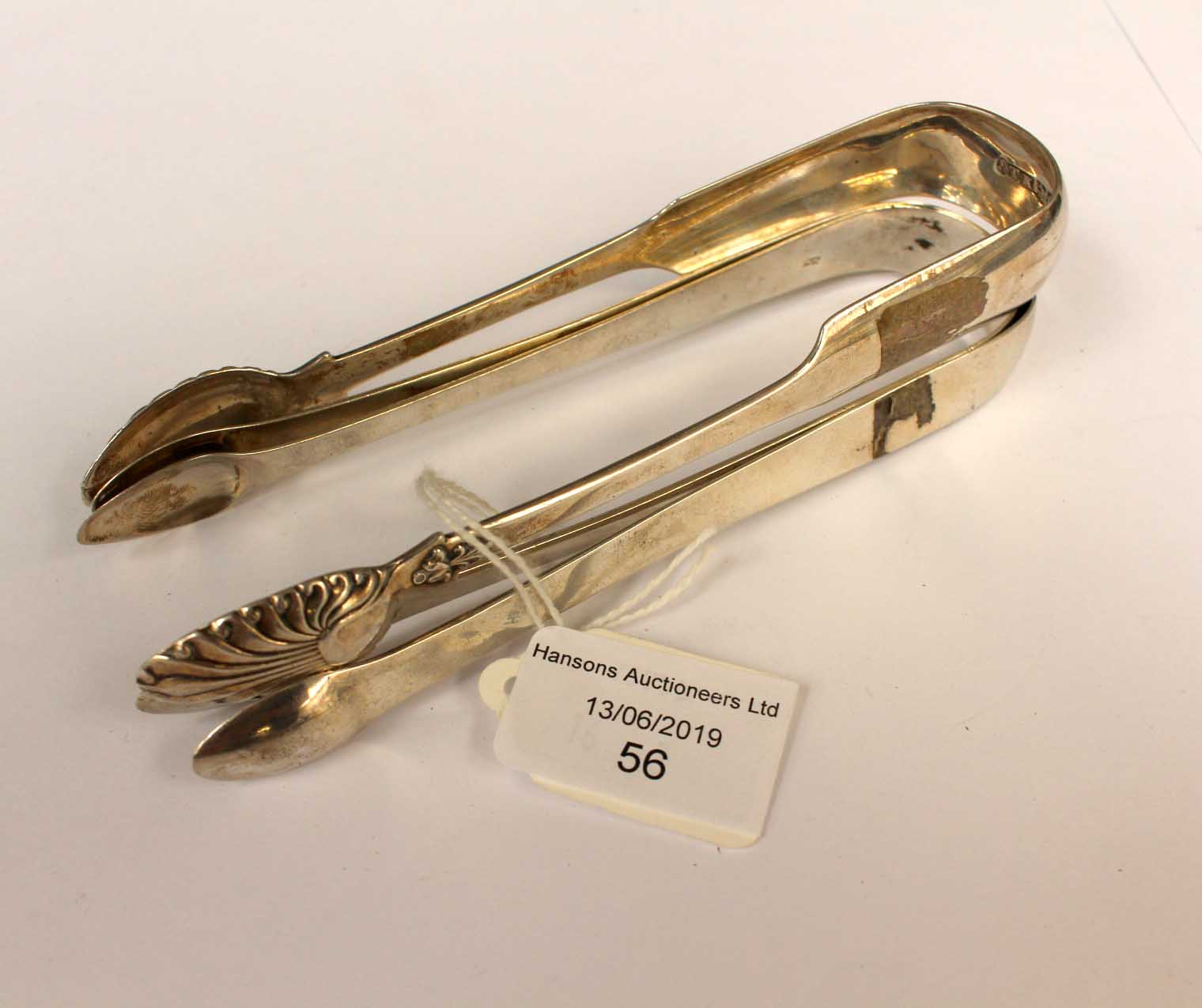 Three pairs of silver sugar tongs, silver combined total weight approx 3.