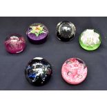 A collection of six Caithness glass paperweights including; Chantilly; a floral Fountain;
