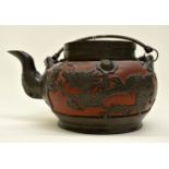 A Chinese terracotta and lead teapot,