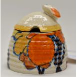 Clarice Cliff for Newport Pottery, a small Orange Autumn beehive honey pot, Bizarre marks, 7.