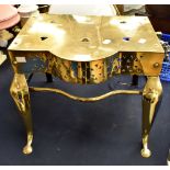 An early 19th Century brass kettle warming stand, the top pierced with heart shaped design,