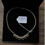 A Monet gold plated necklace in original box,