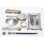 Silver backed hair/clothes brushes, bangle, walking cane tops, photo frame,