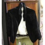 An early 1930's black velvet jacket,