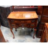 A mahogany bow fronted low boy, one long drawer over three short raised on cabriole legs.