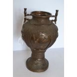 A Japanese Meiji Period bronze twin handled vase,