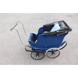 An early 20th century Millsons Pram, repainted, dual pram, measuring approx, 140cm length,