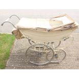 A mid 20th century Osnath, London pram, Millson design, cream body, wheels re-chromed,