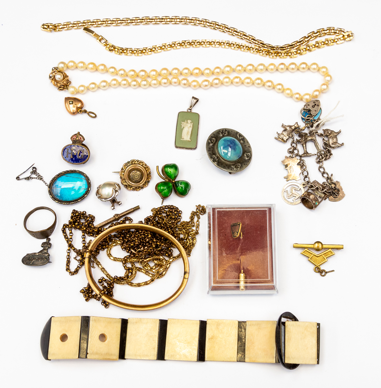 A collection of costume jewellery to include a Victorian unmarked yellow metal brooch,
