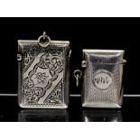 An Edwardian silver vesta case, engraved with foliate decoration and central monogram, Arthur Cook,