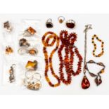 A quantity of amber and amber type necklaces together with bracelets,